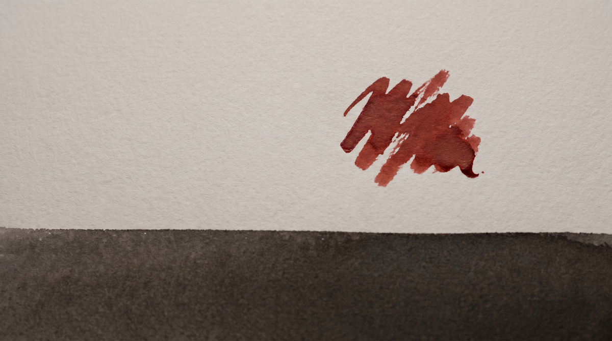 A mark just made on pale paper — ink still settling, the weight of a claim that cannot be unmade.