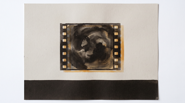 Two nearly identical film frames side by side — archival amber, the condition of duplication where neither copy can be verified as original.